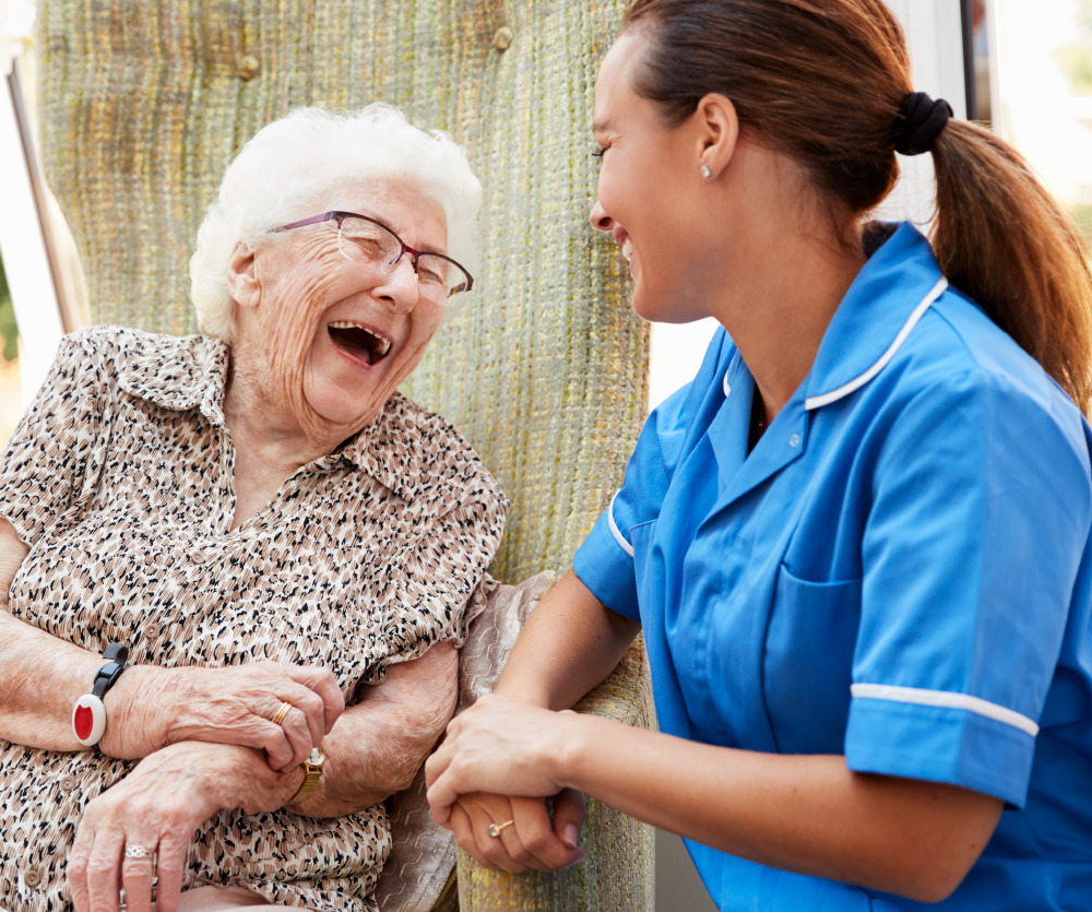 Senior resident laughing with a team member