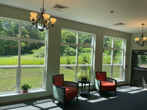 Gathering room with floor to ceiling picture windows