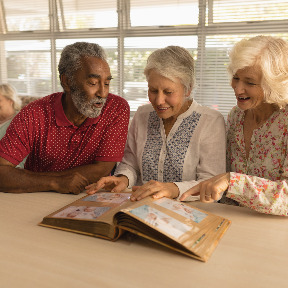 Seniors looking at a photo album